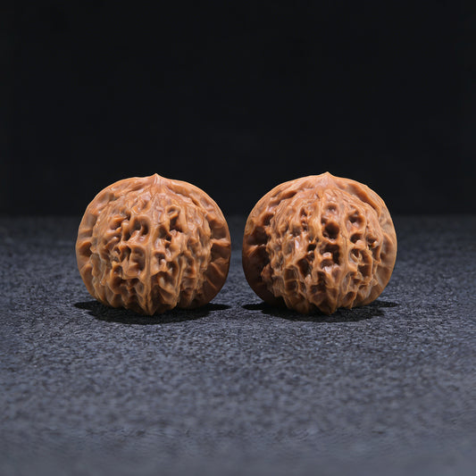 Walnut hand exerciser from ThePatinaProject, featuring a porcelain doll design, boutique grade, 38mm x 35mm size, CWW-704 model.