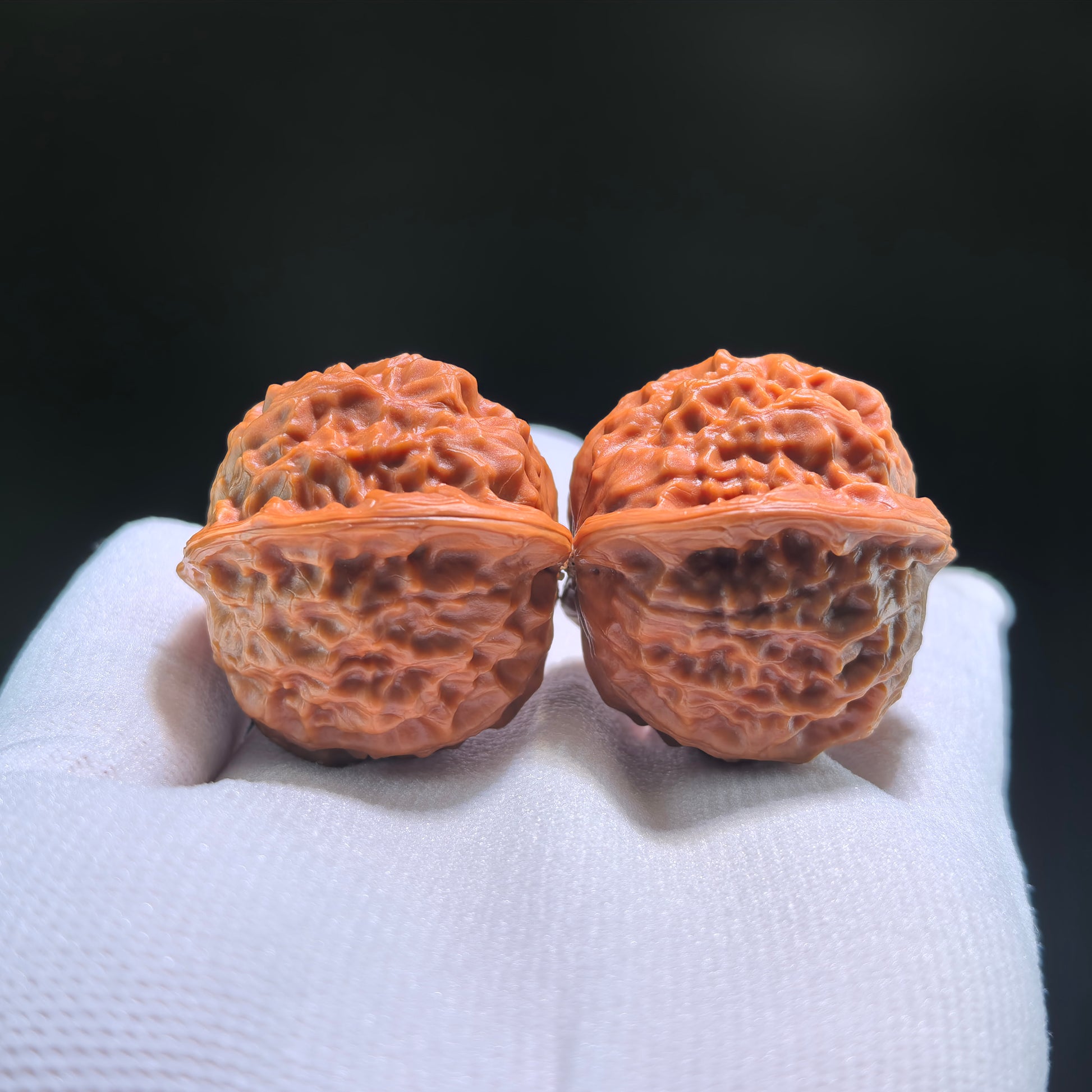Walnut hand exercisers from ThePatinaProject featuring porcelain doll design, boutique grade, 38mm x 35mm size, CWW-704 model.