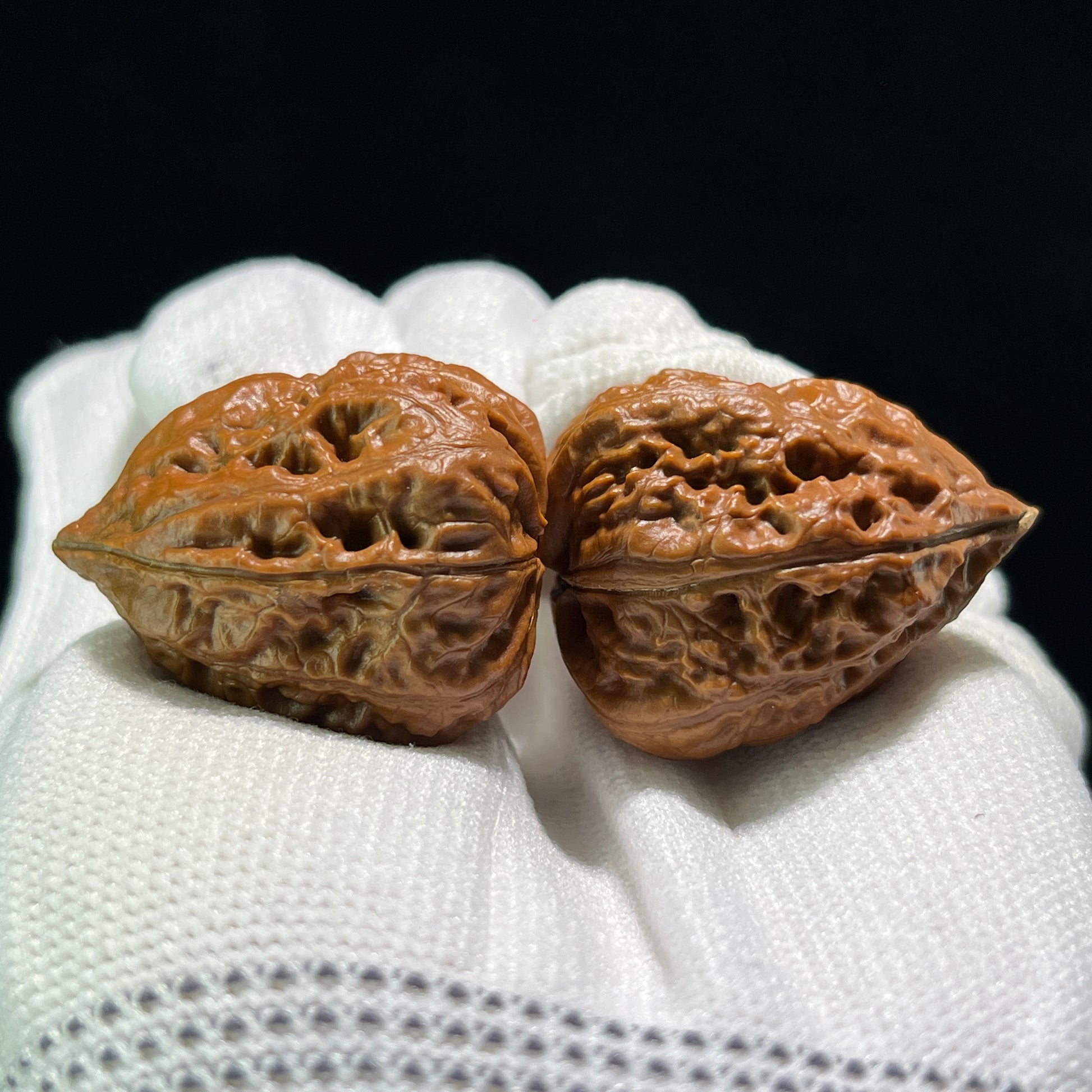 Four-faced walnut hand exerciser mini pair from ThePatinaProject, 26mm x 25mm, featuring detailed carved frog designs.