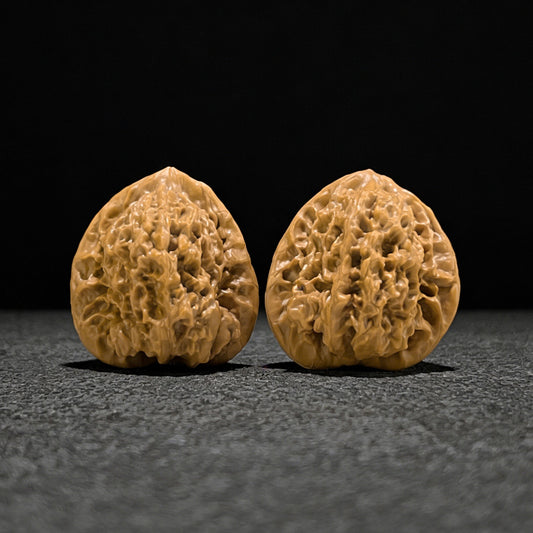 Walnut hand exerciser pair featuring Gecko x Arhat Head design, 41mm x 38mm, from ThePatinaProject BHLHT-701 collection.