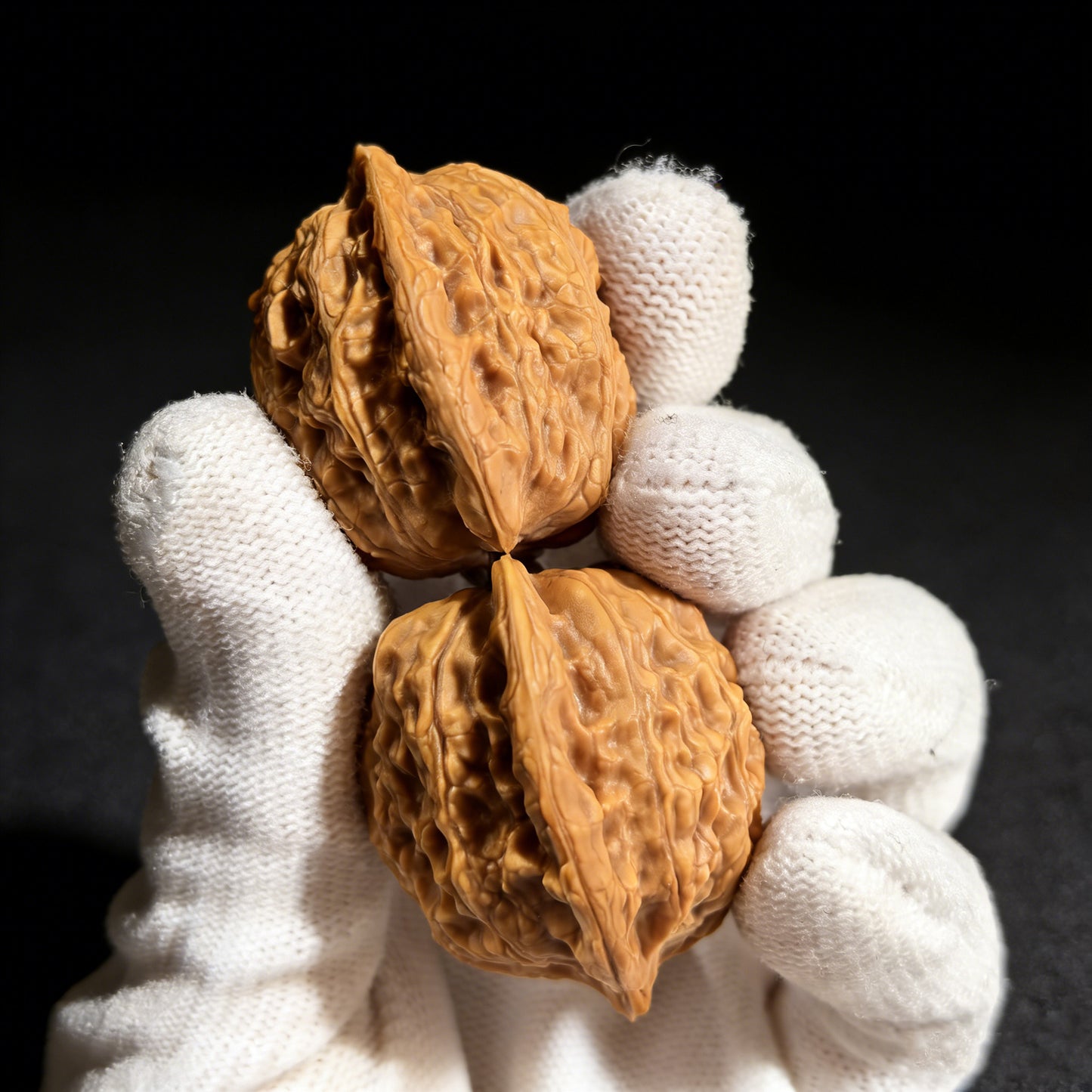 Pair of walnut hand exercisers labeled Gentleman’s Hat (Gongzi Mao) from ThePatinaProject, 37mm size, showing textured wooden surface.