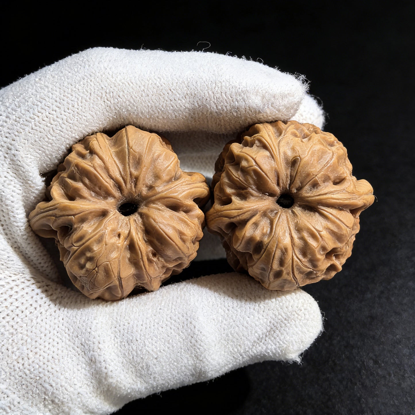 Walnut hand exercisers, the Gentleman’s Hat pair from ThePatinaProject, featuring 37mm diameter Gongzi Mao design.