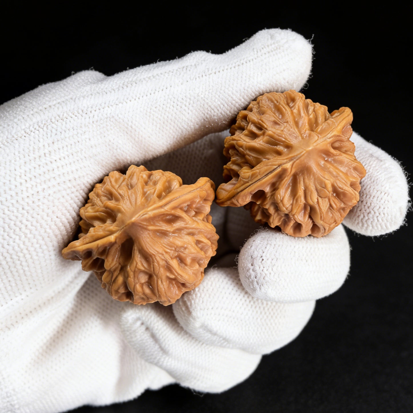 Walnut hand exercisers called Gentleman’s Hat pair from ThePatinaProject, 37mm x 32mm, featuring smooth wooden finish and ergonomic design.