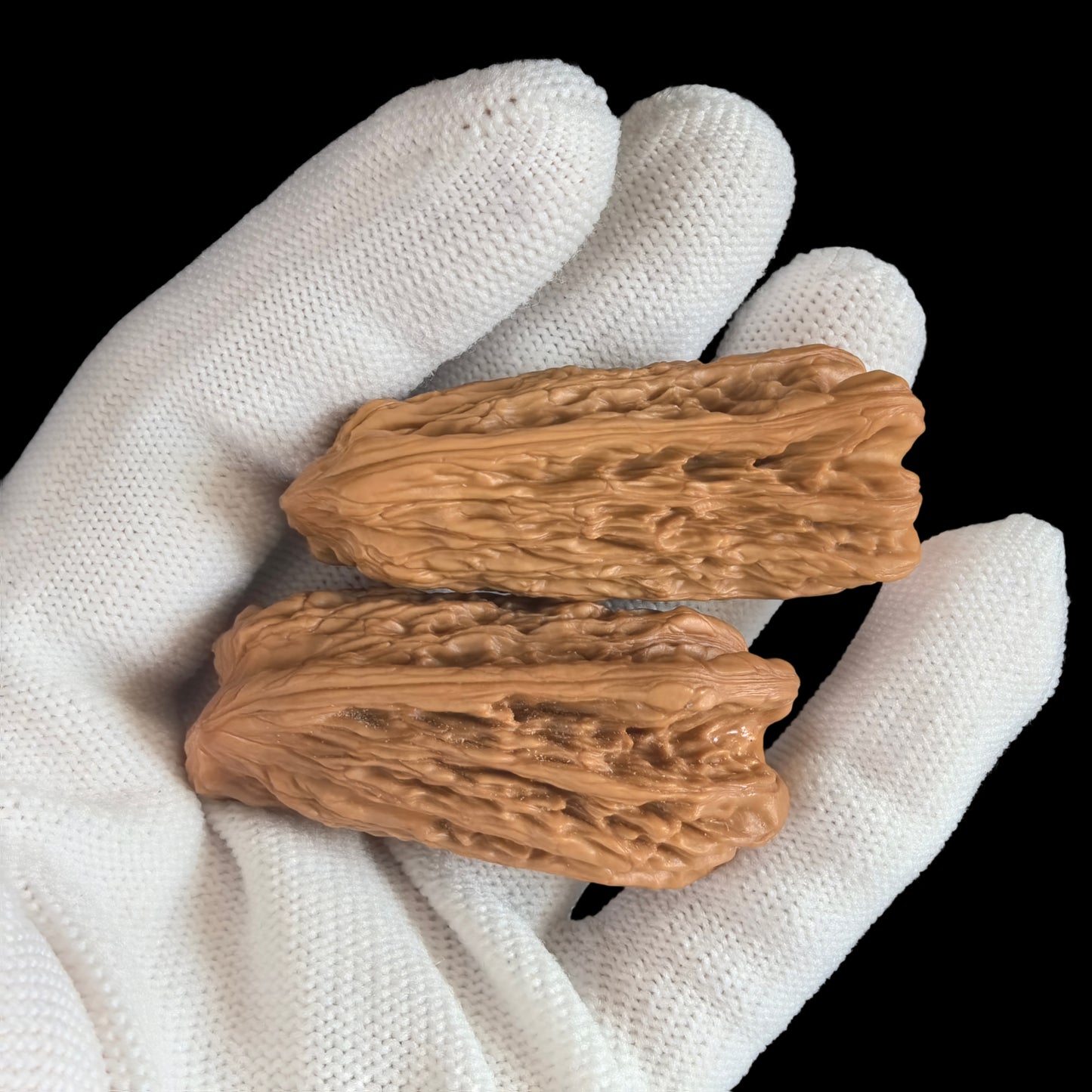 Walnut hand exercisers from ThePatinaProject, featuring the Gold Bar double pendant set with elongated gold bars and symbolic design.