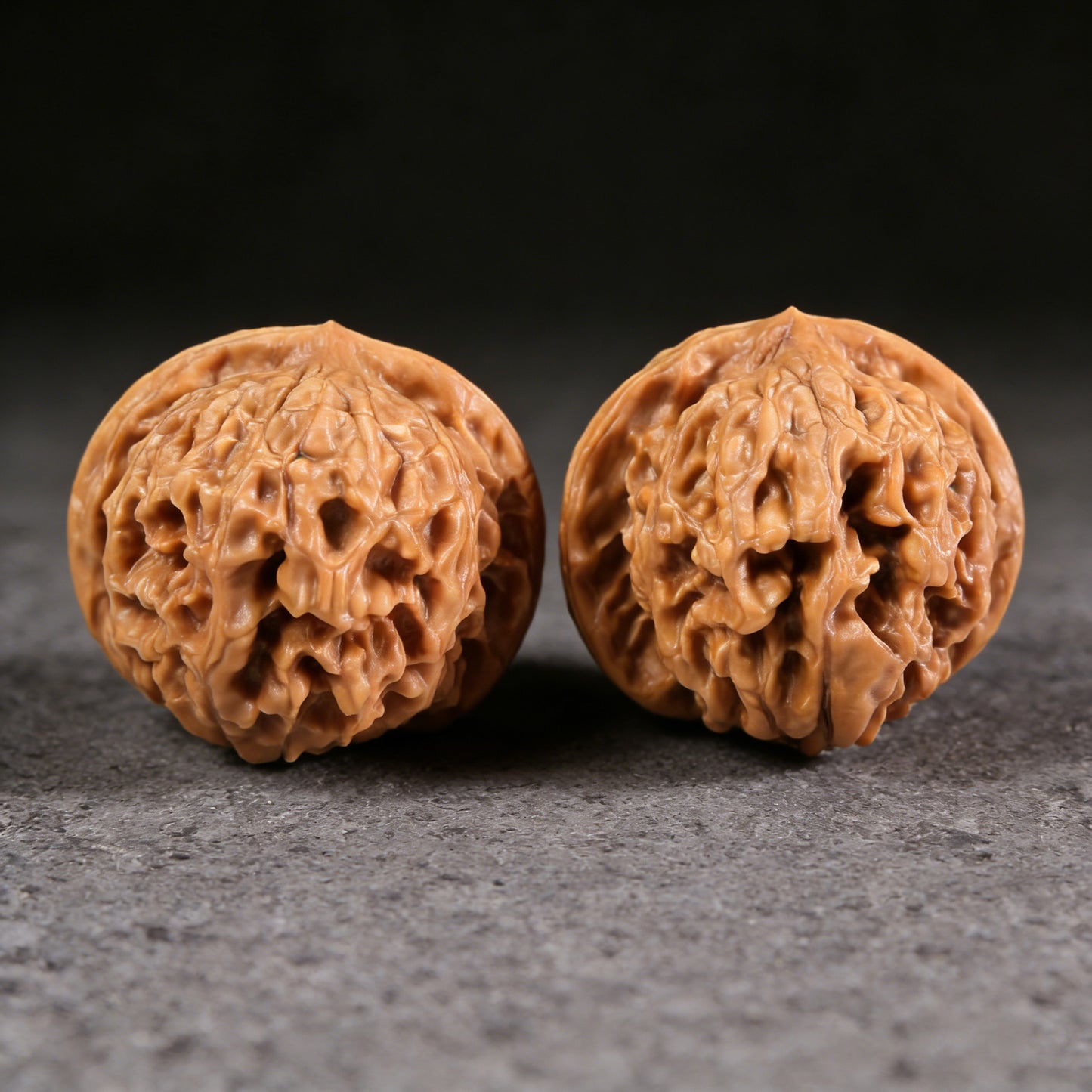 Walnut hand exercisers titled "Golden Ingot" pair, 47mm square, ThePatinaProject, featuring intricate golden ingot design.