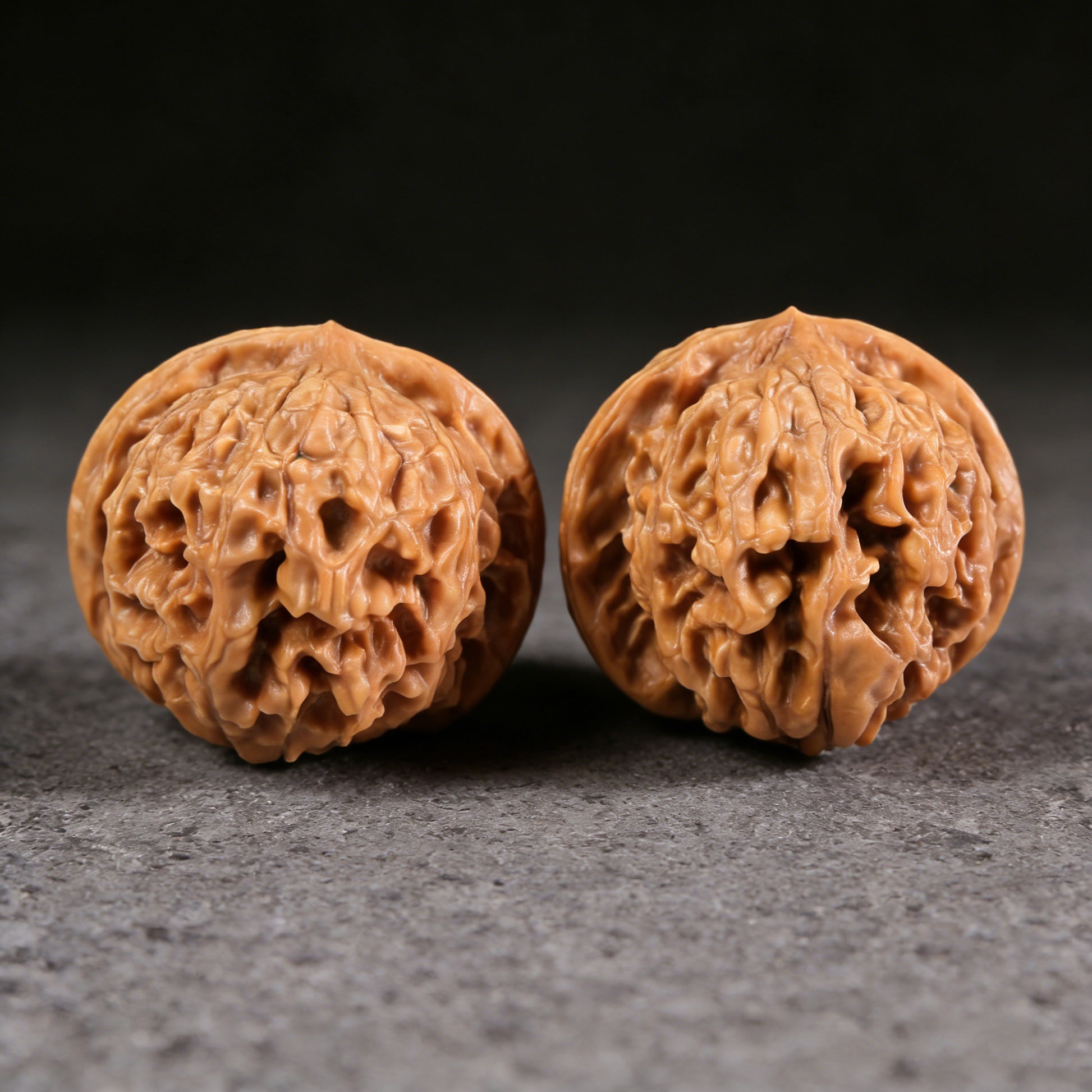 Walnut hand exercisers titled "Golden Ingot" pair, 47mm square, ThePatinaProject, featuring intricate golden ingot design.