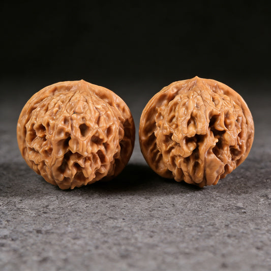 Walnut hand exercisers titled "Golden Ingot" pair, 47mm square, ThePatinaProject, featuring intricate golden ingot design.