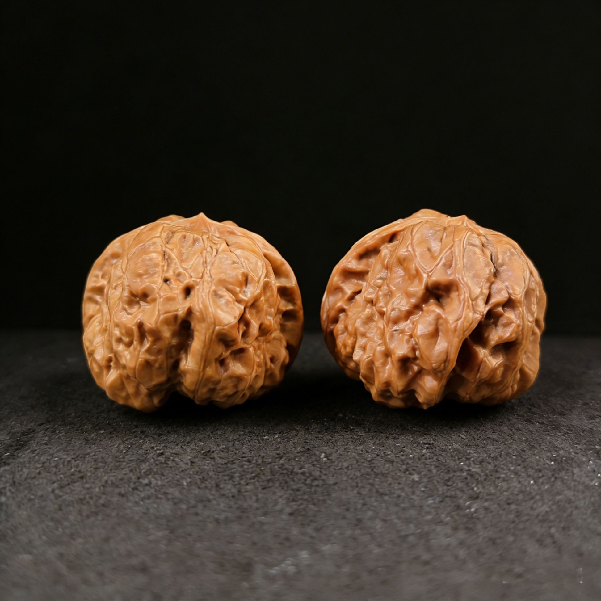 Golden Money Toad walnut hand exerciser, 40mm rare pictographic pair, by ThePatinaProject, featuring detailed carved toad images.