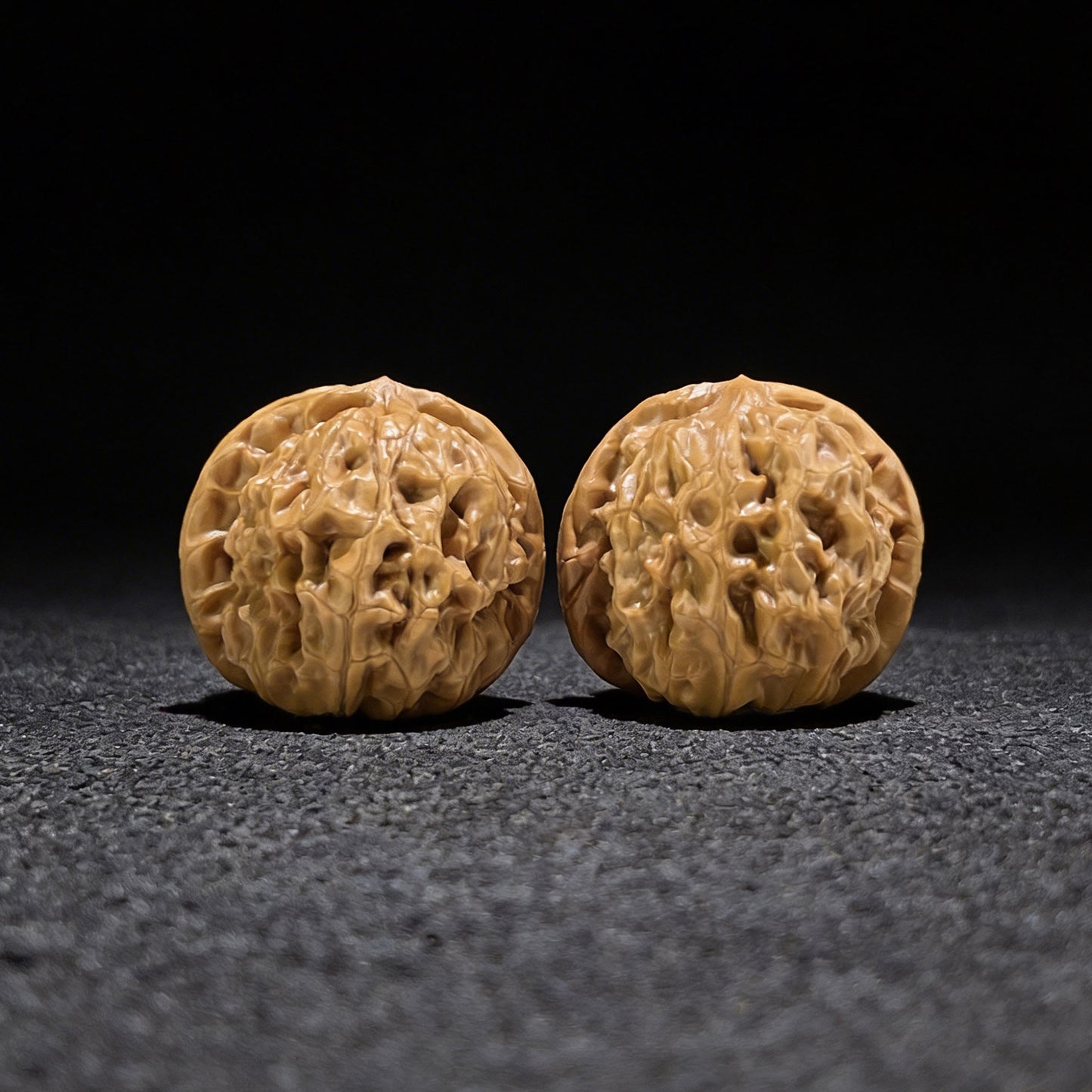Walnut hand exerciser pair named "Harmony" by ThePatinaProject, balanced 1:1 ratio, 40mm x 40mm, ergonomic grip.