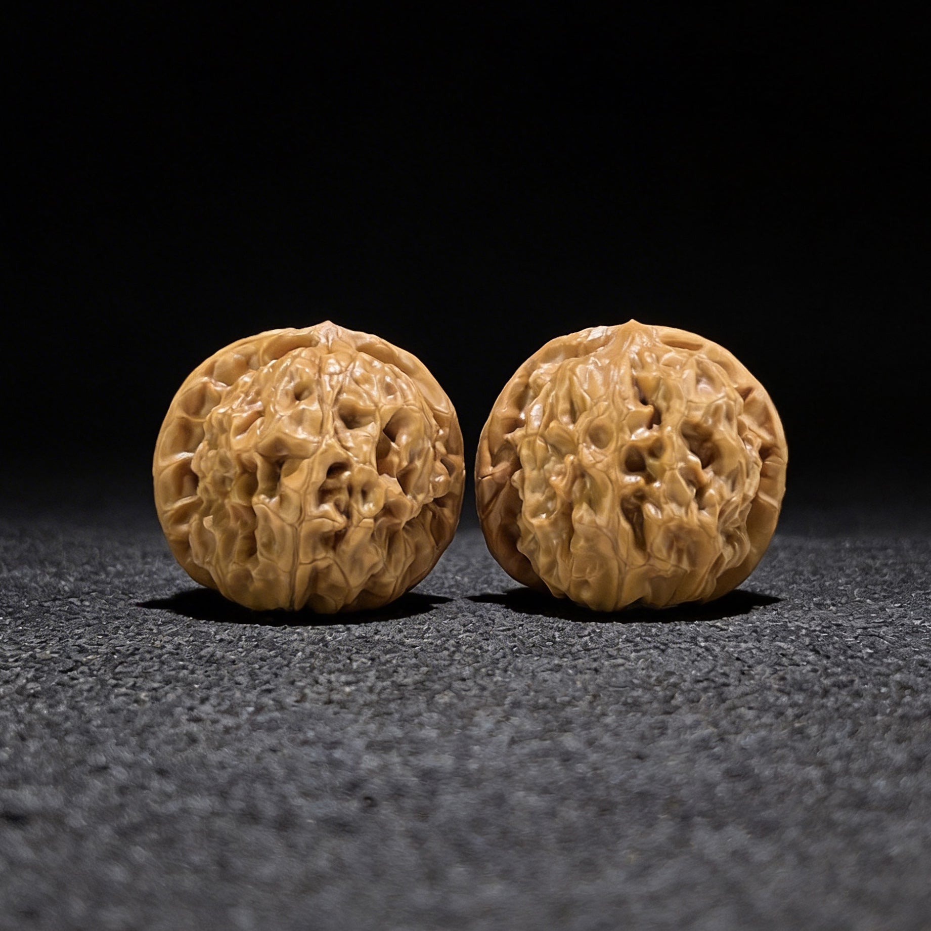 Walnut hand exerciser pair named "Harmony" by ThePatinaProject, balanced 1:1 ratio, 40mm x 40mm, ergonomic grip.