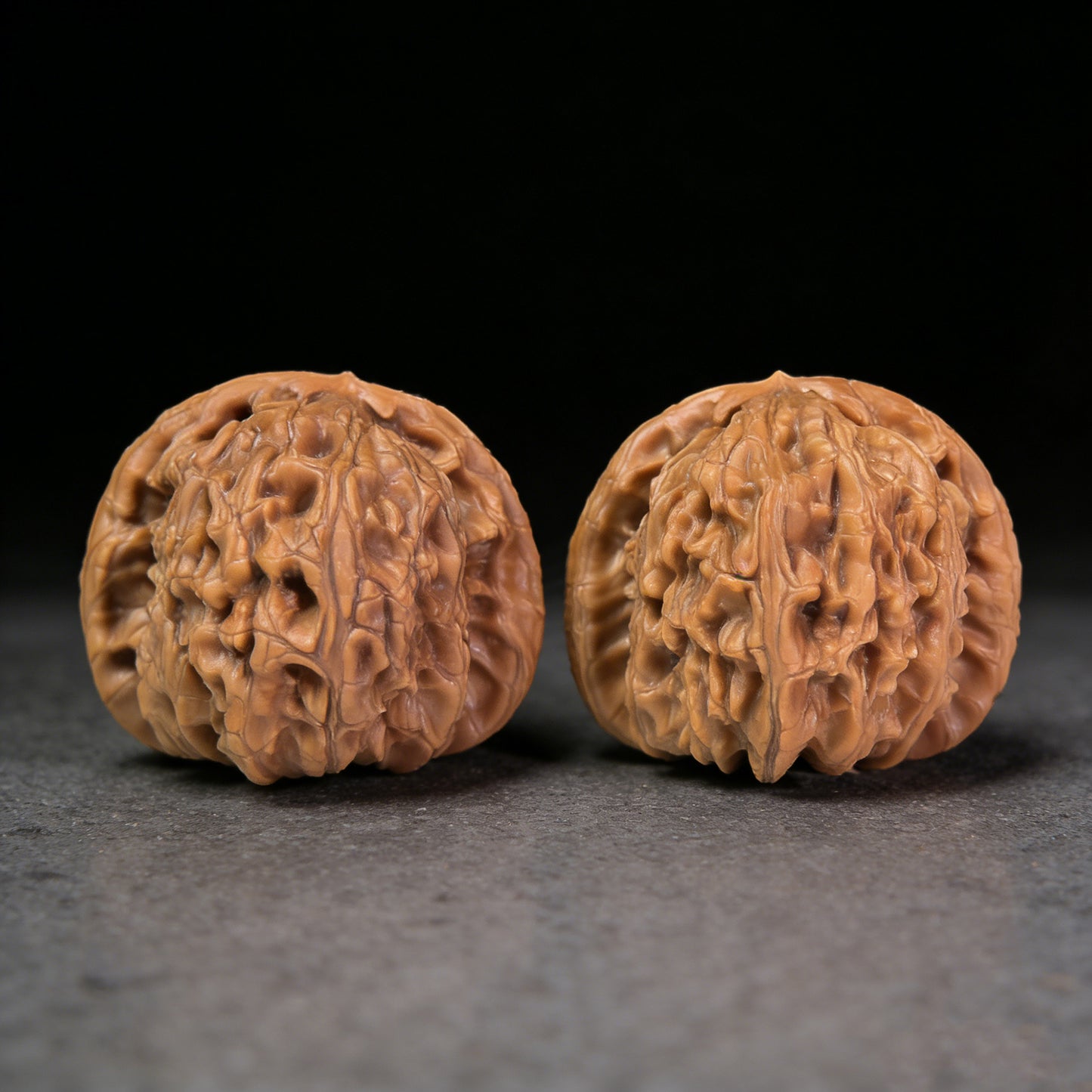 Walnut hand exerciser pair called Hidden Tip White Lion by ThePatinaProject, 48mm x 42mm, natural wood grain detail
