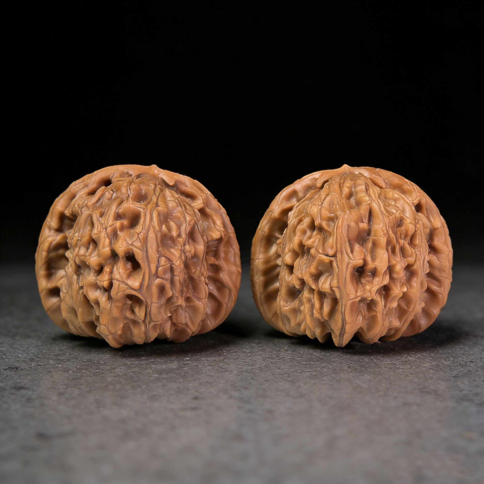Walnut hand exerciser pair called Hidden Tip White Lion by ThePatinaProject, 48mm x 42mm, natural wood grain detail
