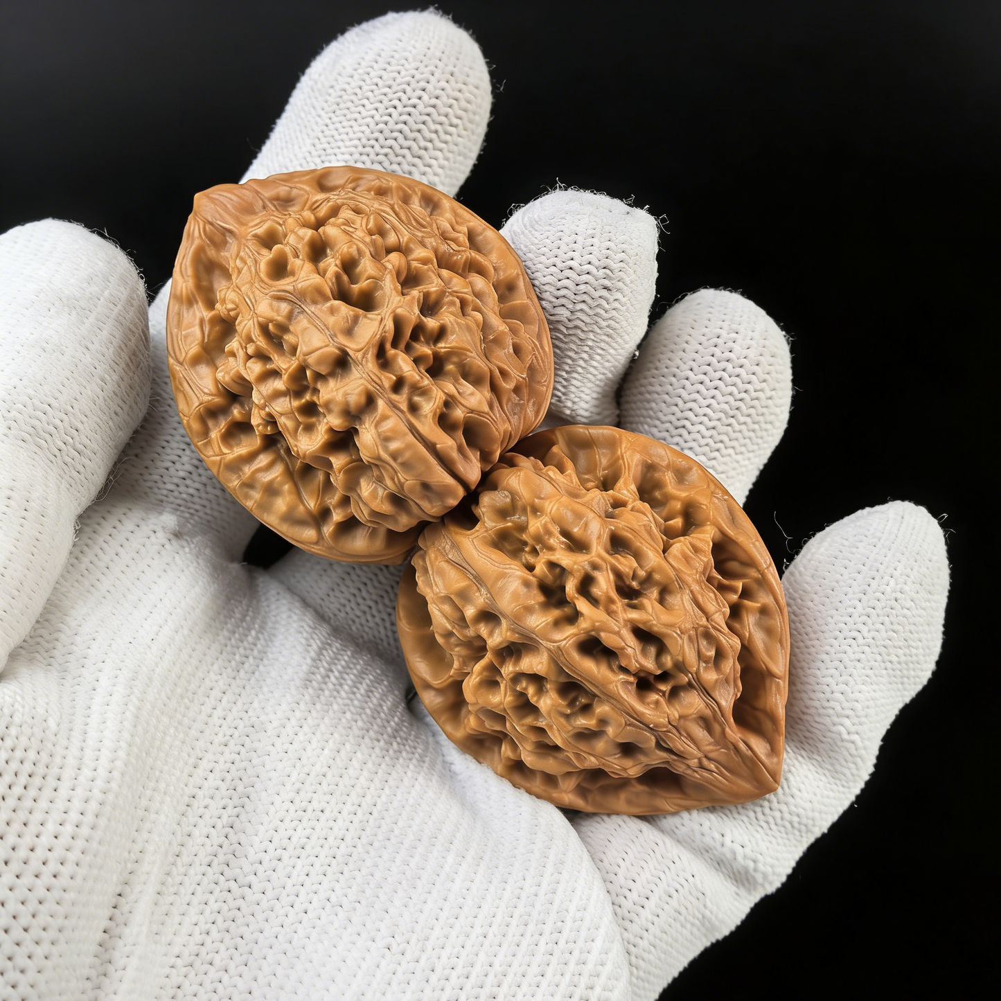 Pair of walnut hand exercisers from ThePatinaProject, featuring the High-Tower Official’s Hat design with symmetrical build and rare proportions.