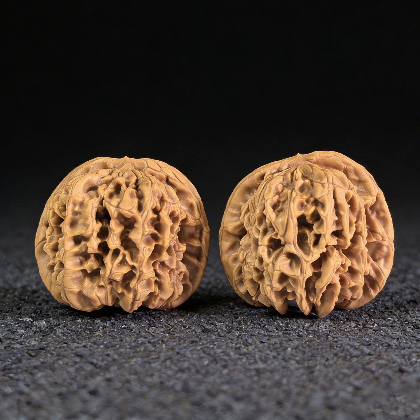 Walnut hand exercisers from ThePatinaProject, Hundred Longevity Bai Shou pair, 47mm x 43mm, natural wood grip tools.