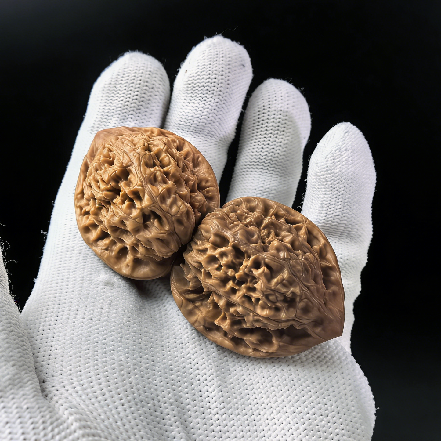 Pair of walnut hand exercisers from ThePatinaProject, featuring the Imperial Micro-Guanmao official’s hat design, 33mm petite size.
