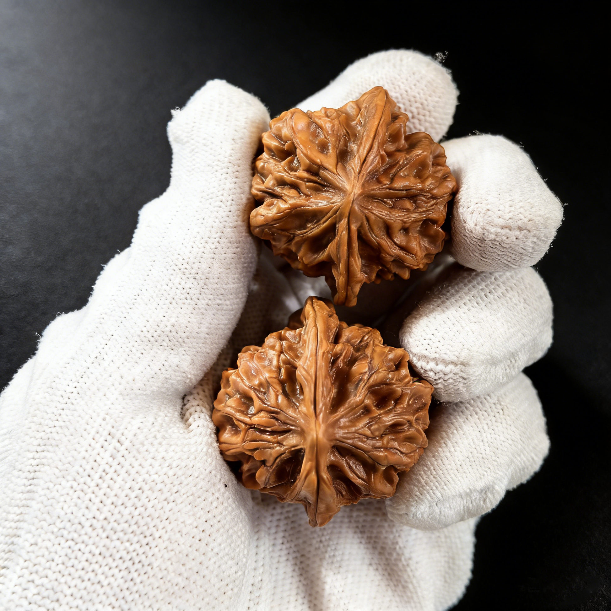 Natural walnut hand exercisers shaped like a crab and architecture design, part of the ThePatinaProject Jade Crab collector’s pair.