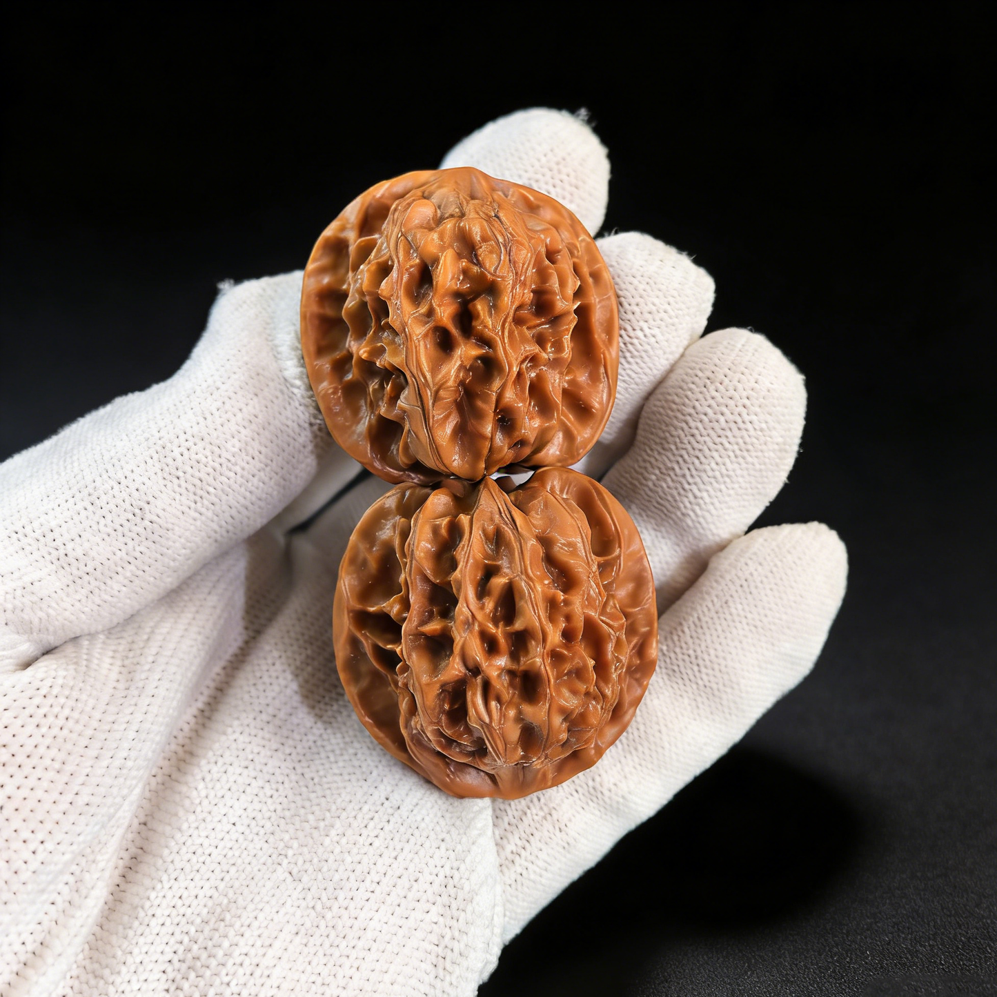 Walnut hand exercisers featuring the Jade Crab design from ThePatinaProject, showcasing intricate crab-shell architecture in a 35mm collector’s pair.