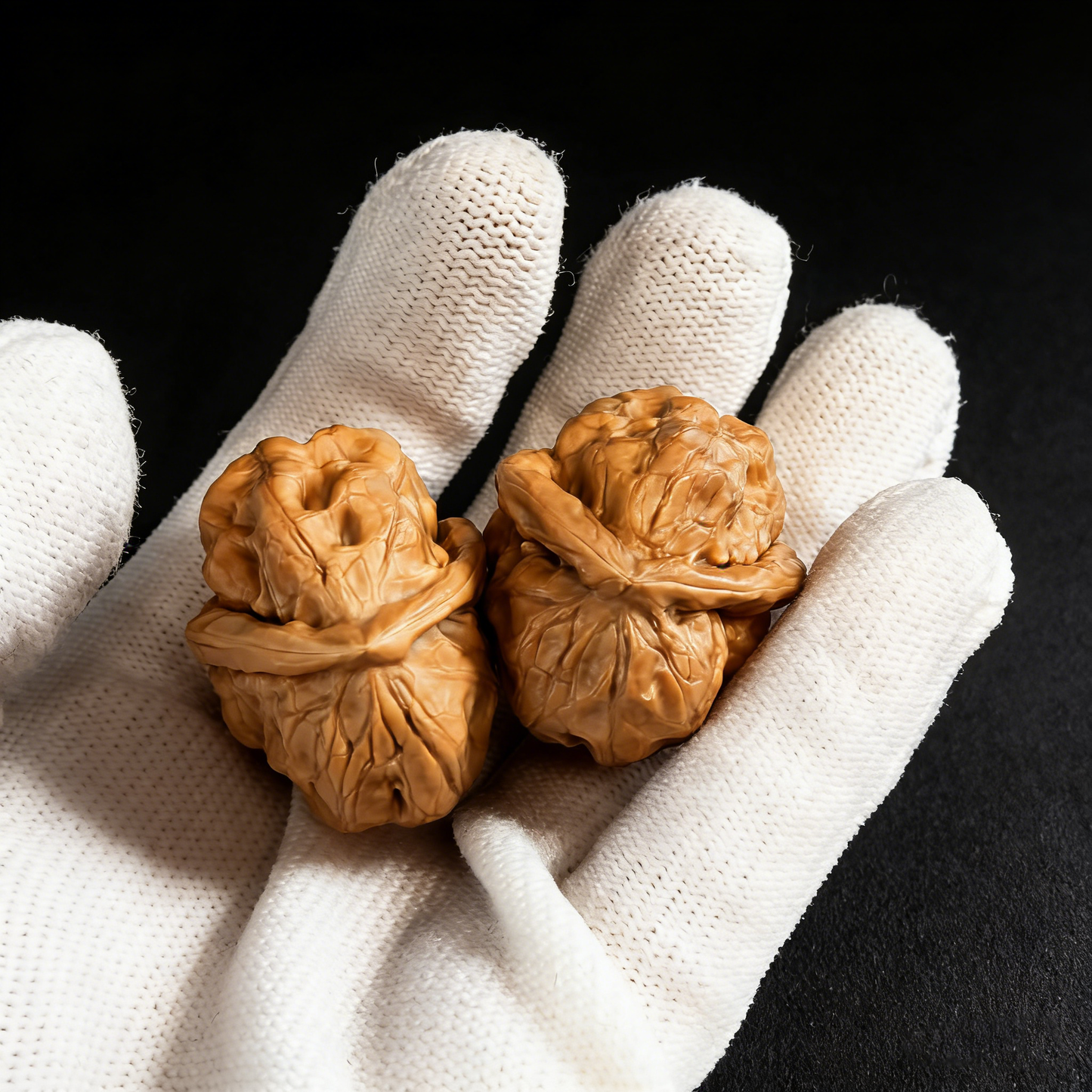 Walnut hand exercisers with Jade Toad "One Day Red" design, 28mm fingertip pair for grip strength and dexterity training.