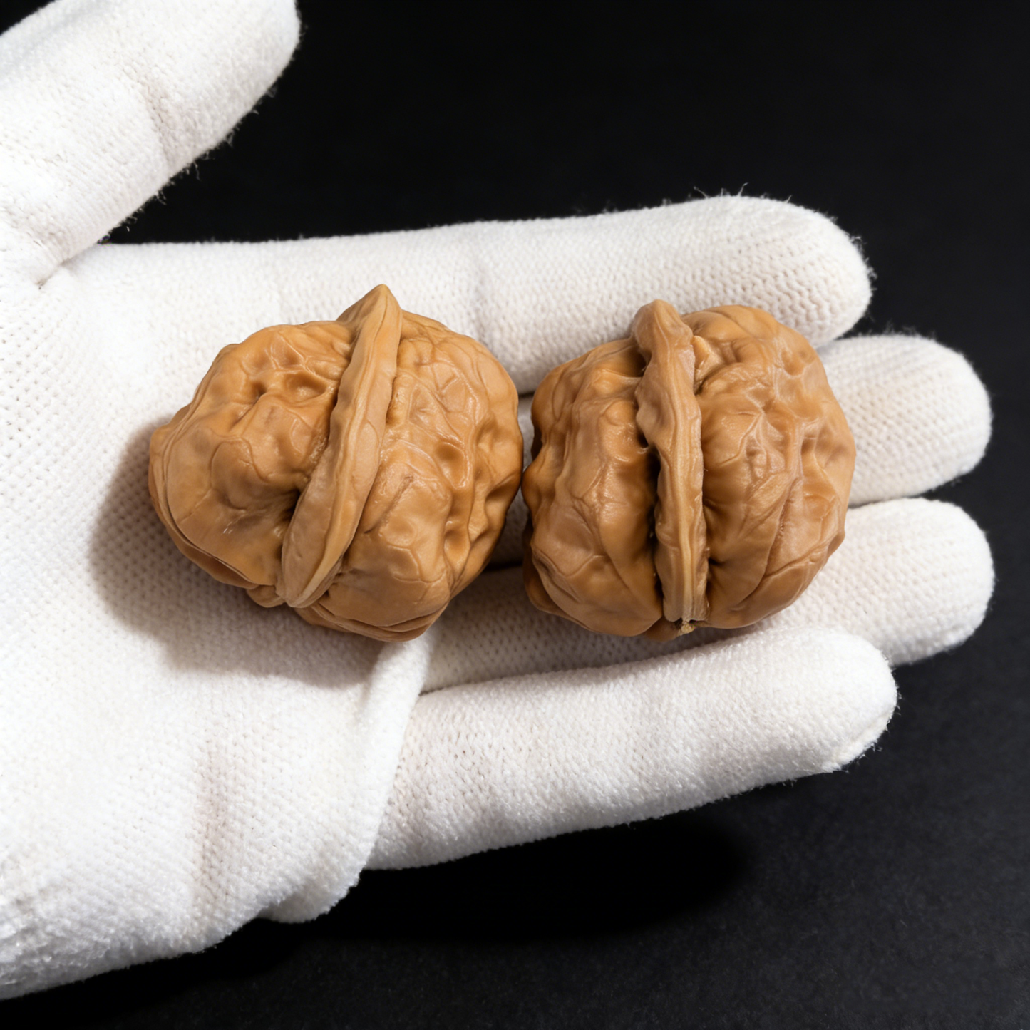 Walnut hand exercisers featuring the Jade Toad (Yu Chan) design, 28mm fingertip pair from ThePatinaProject's One Day Red minis collection.