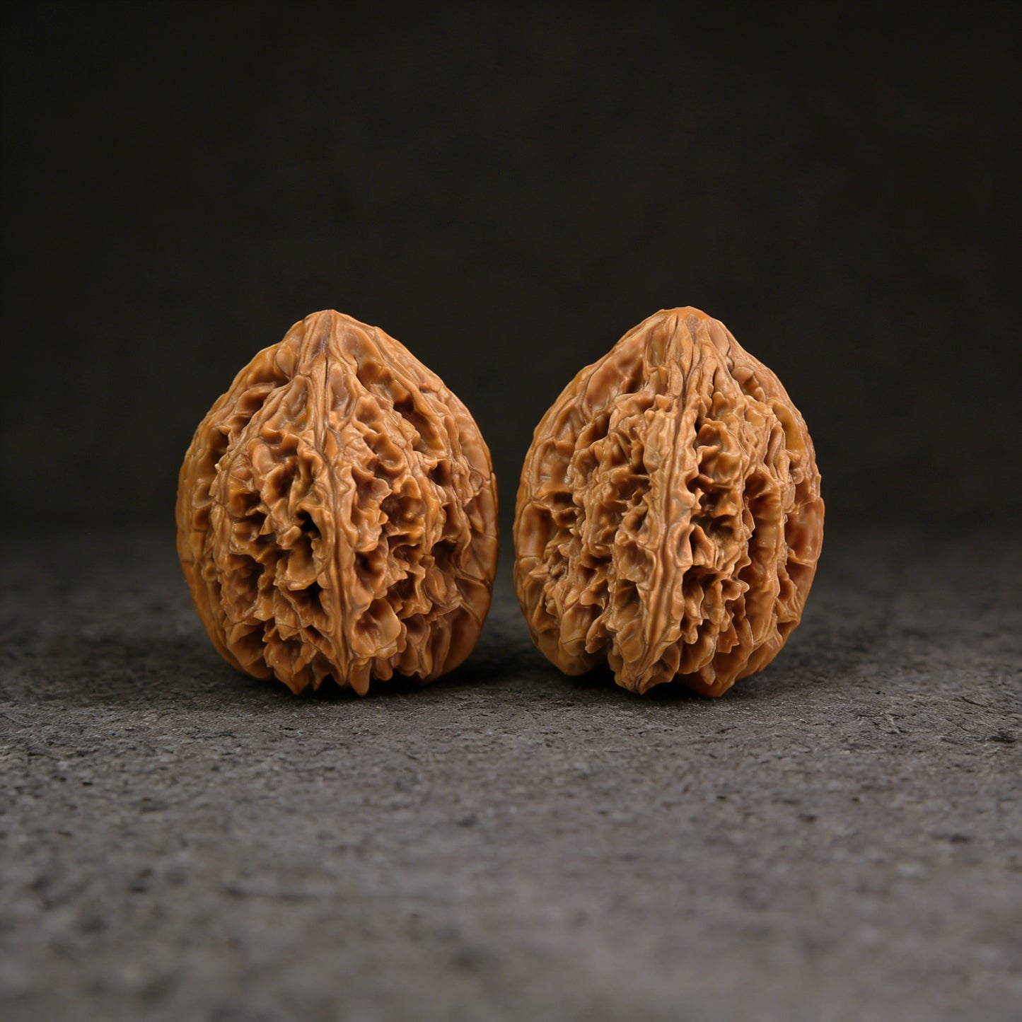 Walnut hand exerciser from ThePatinaProject, 40mm x 48mm, model BX-301, showing textured walnut surface for grip and exercise.