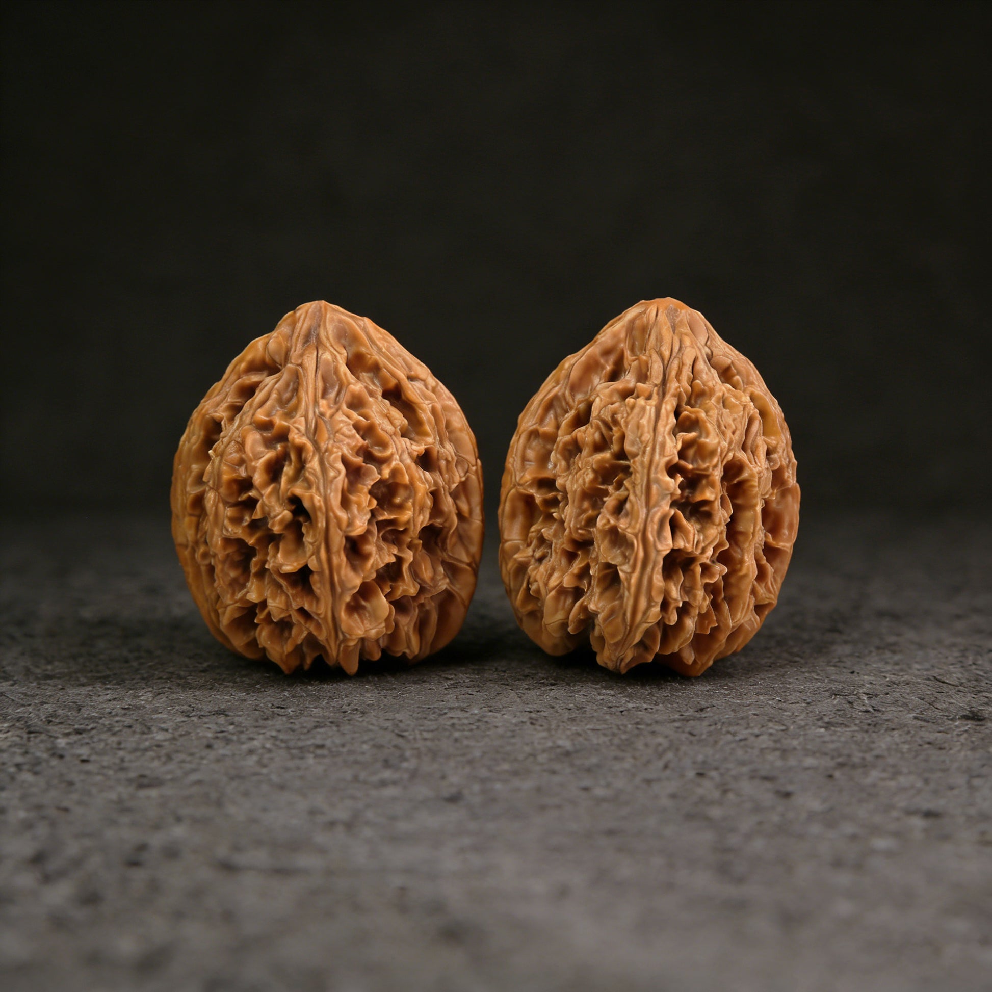 Walnut hand exerciser from ThePatinaProject, 40mm x 48mm, model BX-301, showing textured walnut surface for grip and exercise.