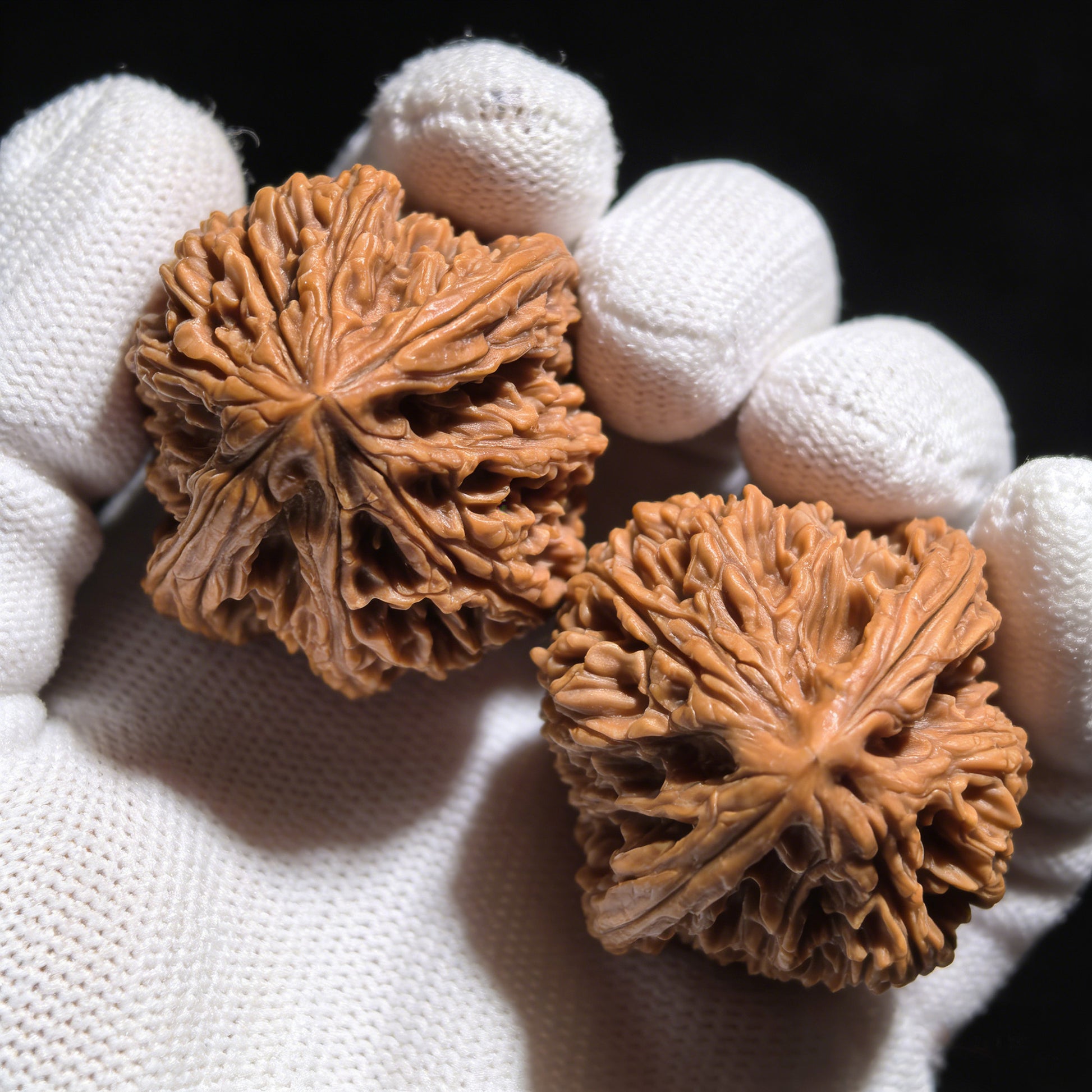Walnut hand exercisers by ThePatinaProject, The Jixin Pair, measuring 40mm x 48mm, showing textured walnut wood grips.