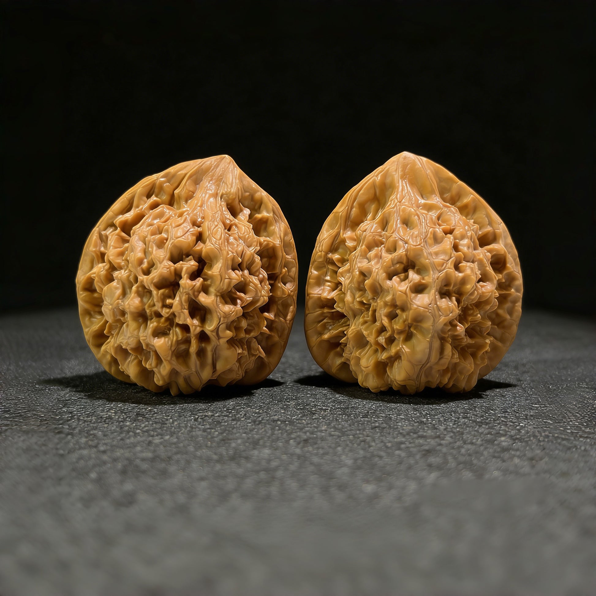 Walnut hand exerciser pair with large official's hat design, 46mm x 42mm, from ThePatinaProject, featuring detailed handcrafted textures.