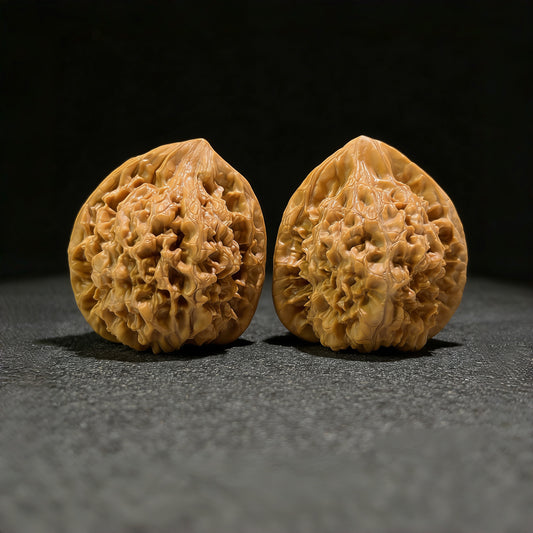 Walnut hand exerciser pair with large official's hat design, 46mm x 42mm, from ThePatinaProject, featuring detailed handcrafted textures.