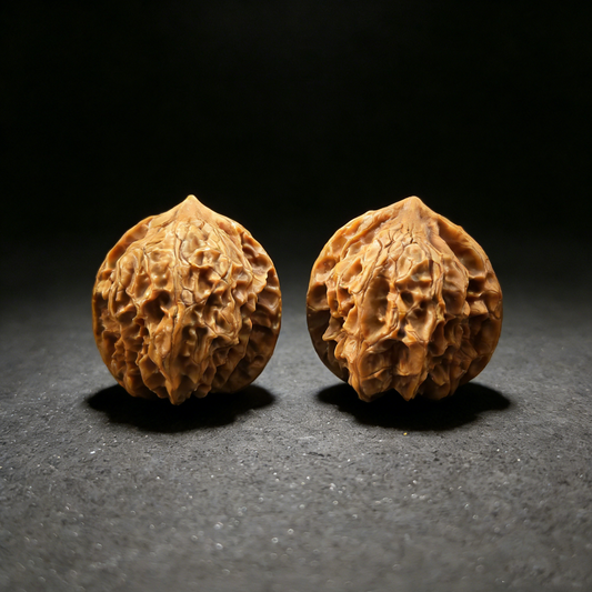 Walnut hand exerciser featuring miniature heart designs, 33mm size from ThePatinaProject's Ling Long Miniature Hearts collection.