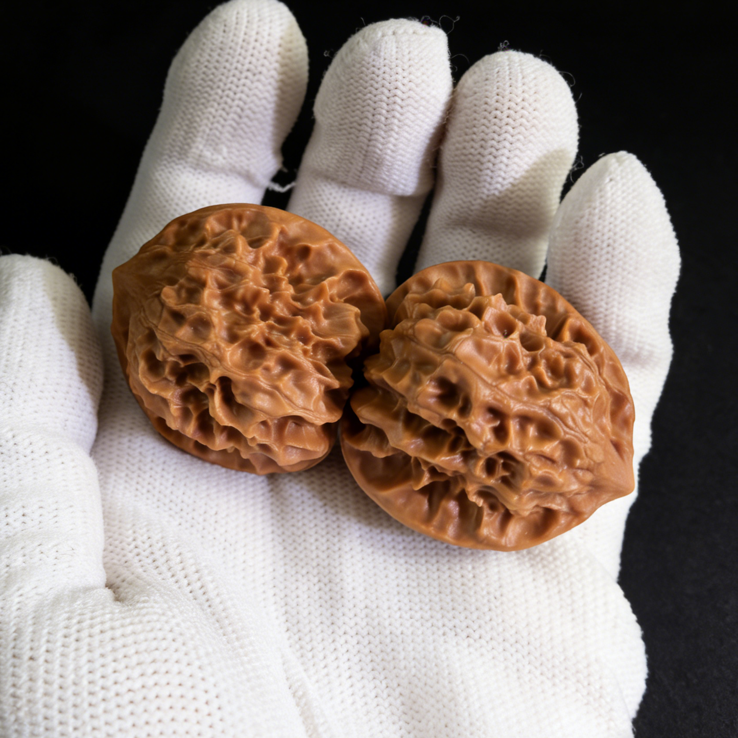 Pair of white snake valley walnut hand exercisers by ThePatinaProject, 34mm size, showing textured walnut wood grips.