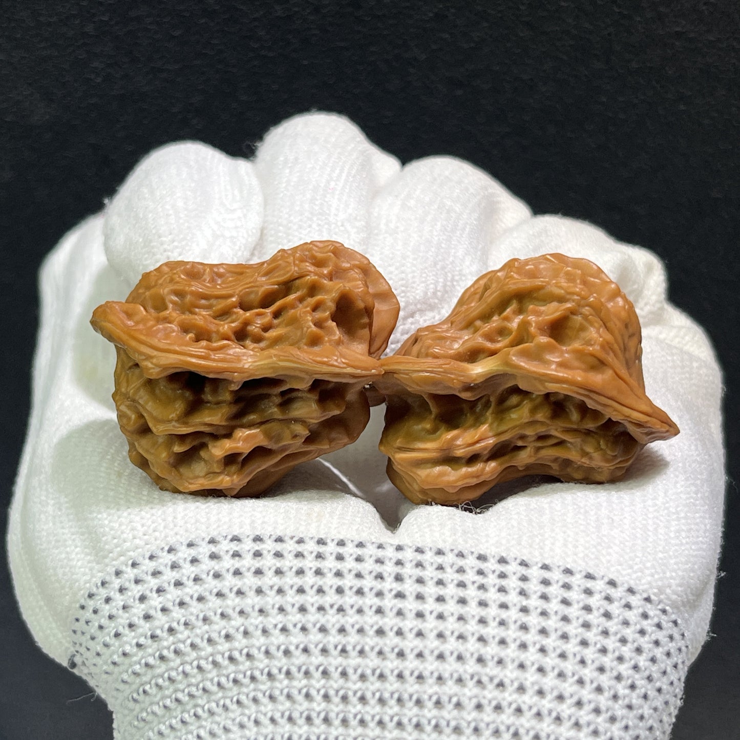 Walnut hand exerciser pair called "Little Bird" by ThePatinaProject, featuring 35mm x 28mm size, ergonomic design for grip training.