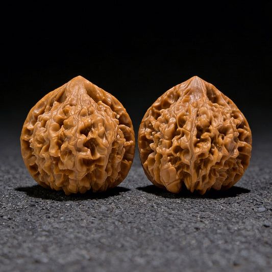 Walnut hand exerciser with the Majestic "Official’s Hat" design by ThePatinaProject, boutique grade, measuring 49x44mm.
