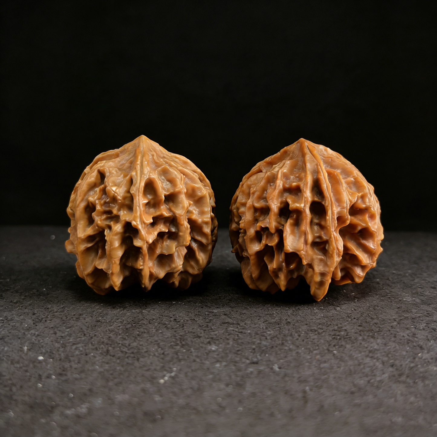Mercedes Pair natural 3-ridge walnut hand exercisers by ThePatinaProject, featuring textured San Leng walnut wood grips.