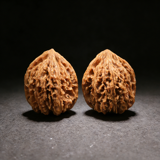 Walnut hand exercisers called "Meteor Shower" (Liu Xing Yu) 37mm deep ridge pair by ThePatinaProject, shown with textured ridges.