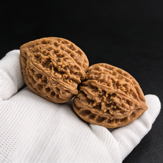 Pair of walnut hand exercisers named Meteor Shower (Liu Xing Yu) with 37mm deep ridges, by ThePatinaProject.