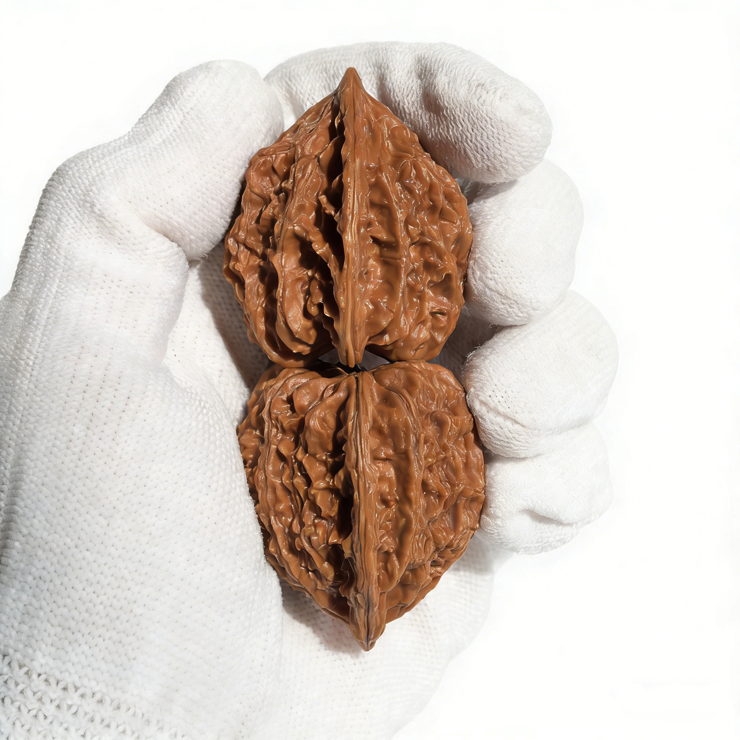 Walnut hand exerciser pair with starry "Meteor Shower" texture and heart-shaped design, 37mm size from ThePatinaProject.