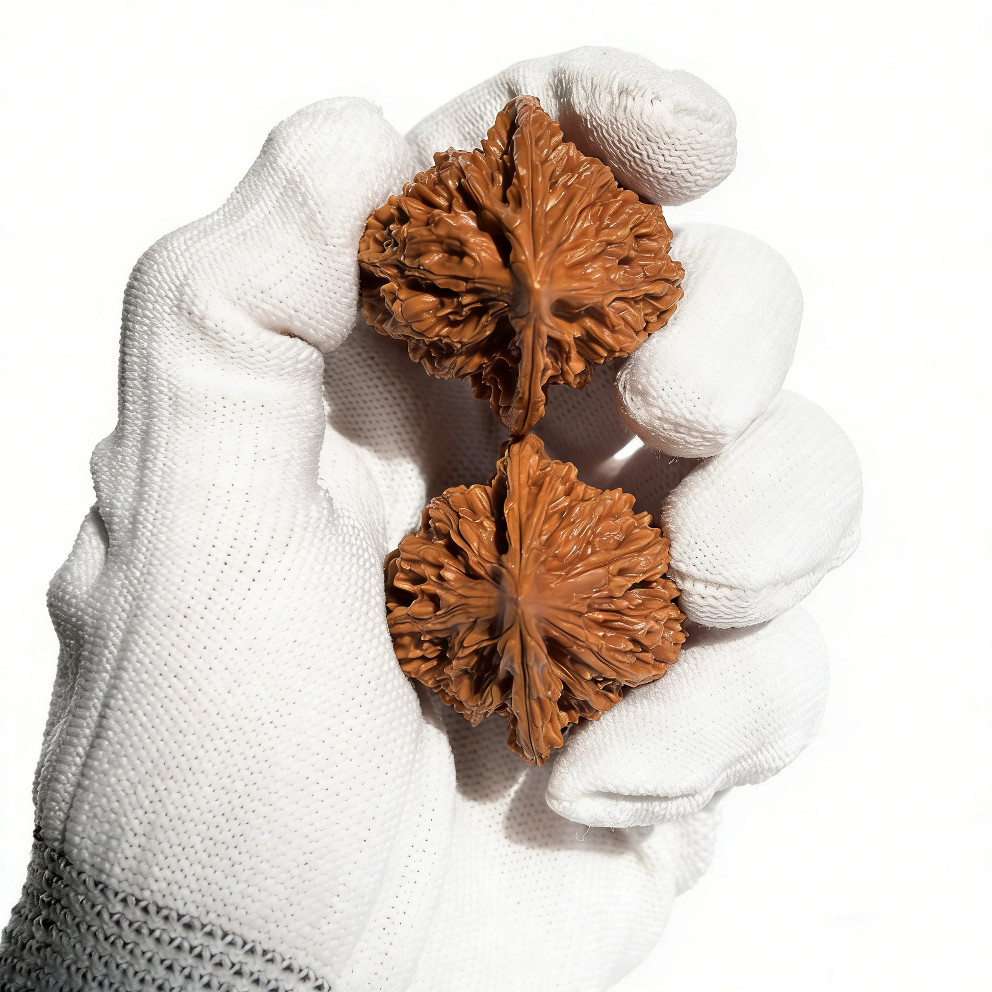 Pair of Walnut hand exercisers featuring "Meteor Shower" texture and heart-shaped design by ThePatinaProject, 37mm collector’s size.