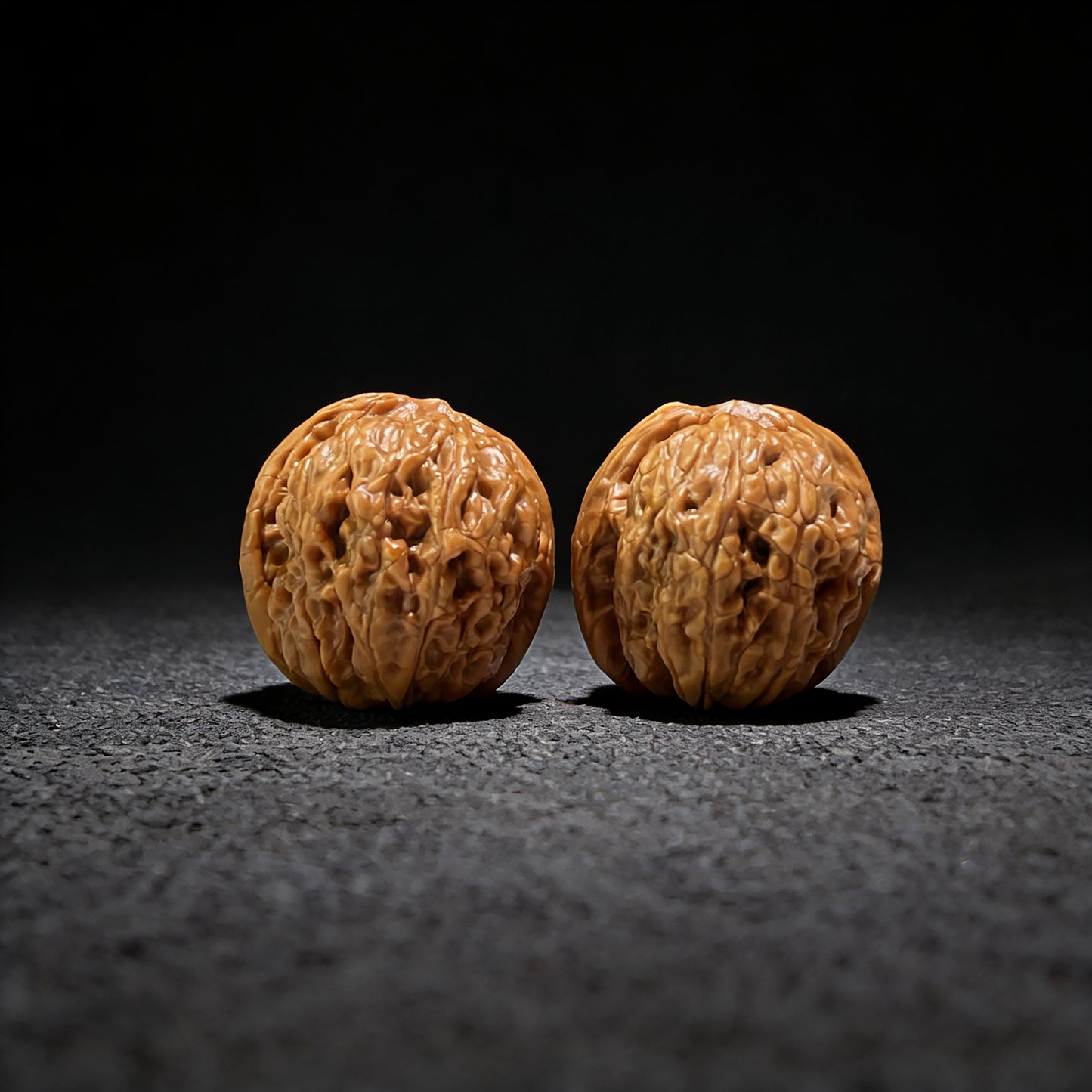 Mini pair of Walnut Hand Exercisers shaped like Meteorite Ingots, 31mm x 34mm, from ThePatinaProject YSYB-601 collection.
