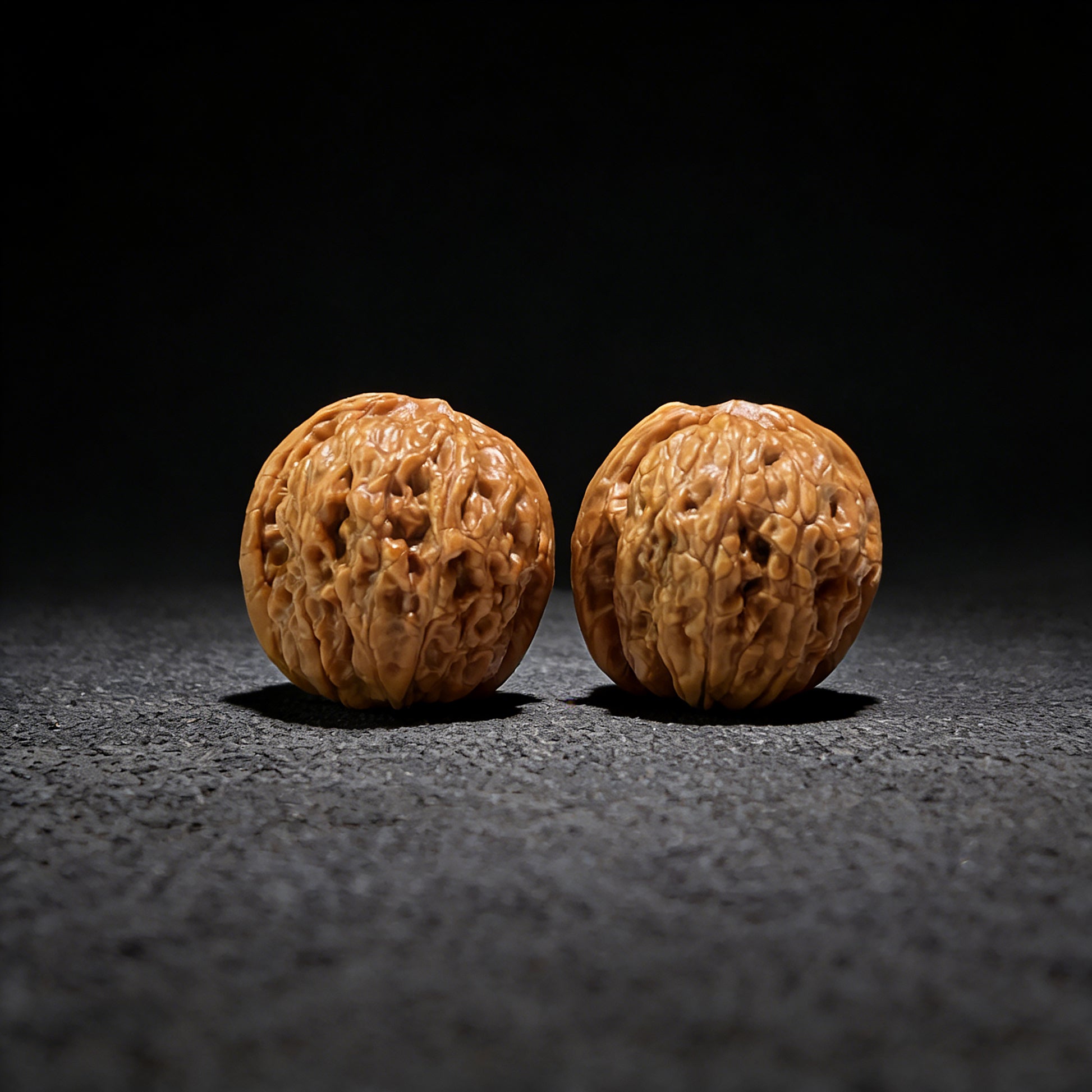 Mini pair of Walnut Hand Exercisers shaped like Meteorite Ingots, 31mm x 34mm, from ThePatinaProject YSYB-601 collection.