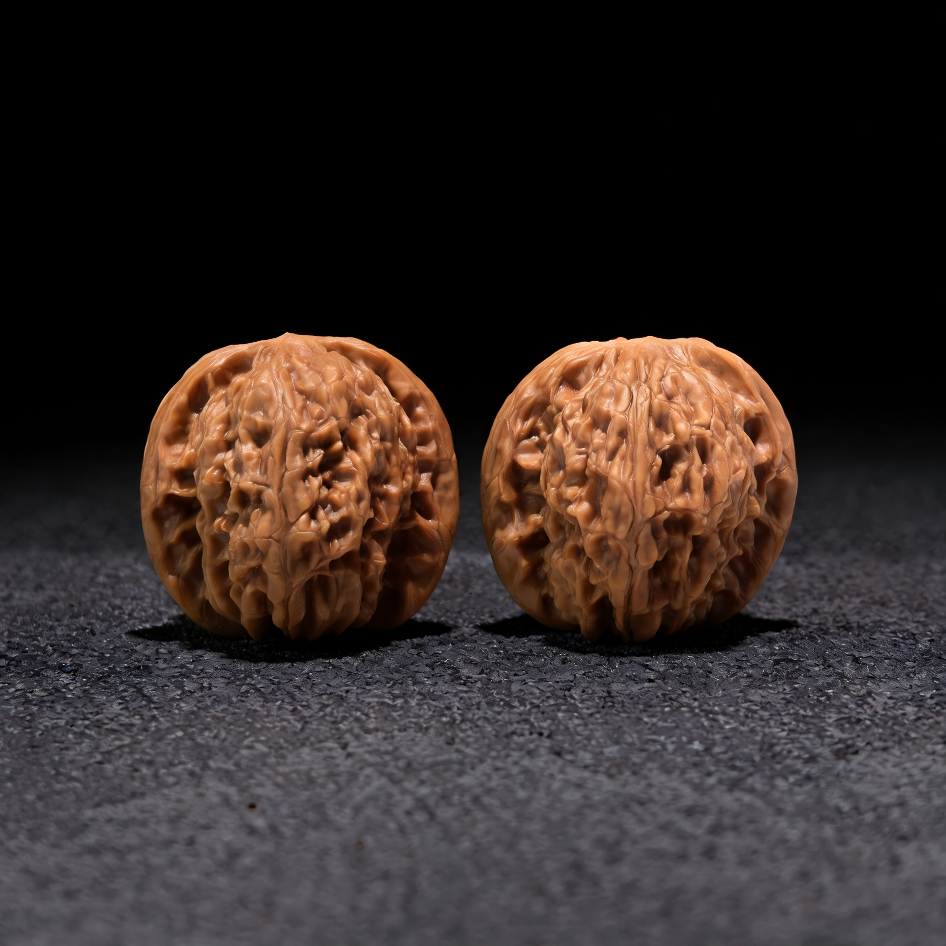 Pair of Walnut Millstone hand exercisers from ThePatinaProject, 37mm x 37mm, designed for grip strength training.