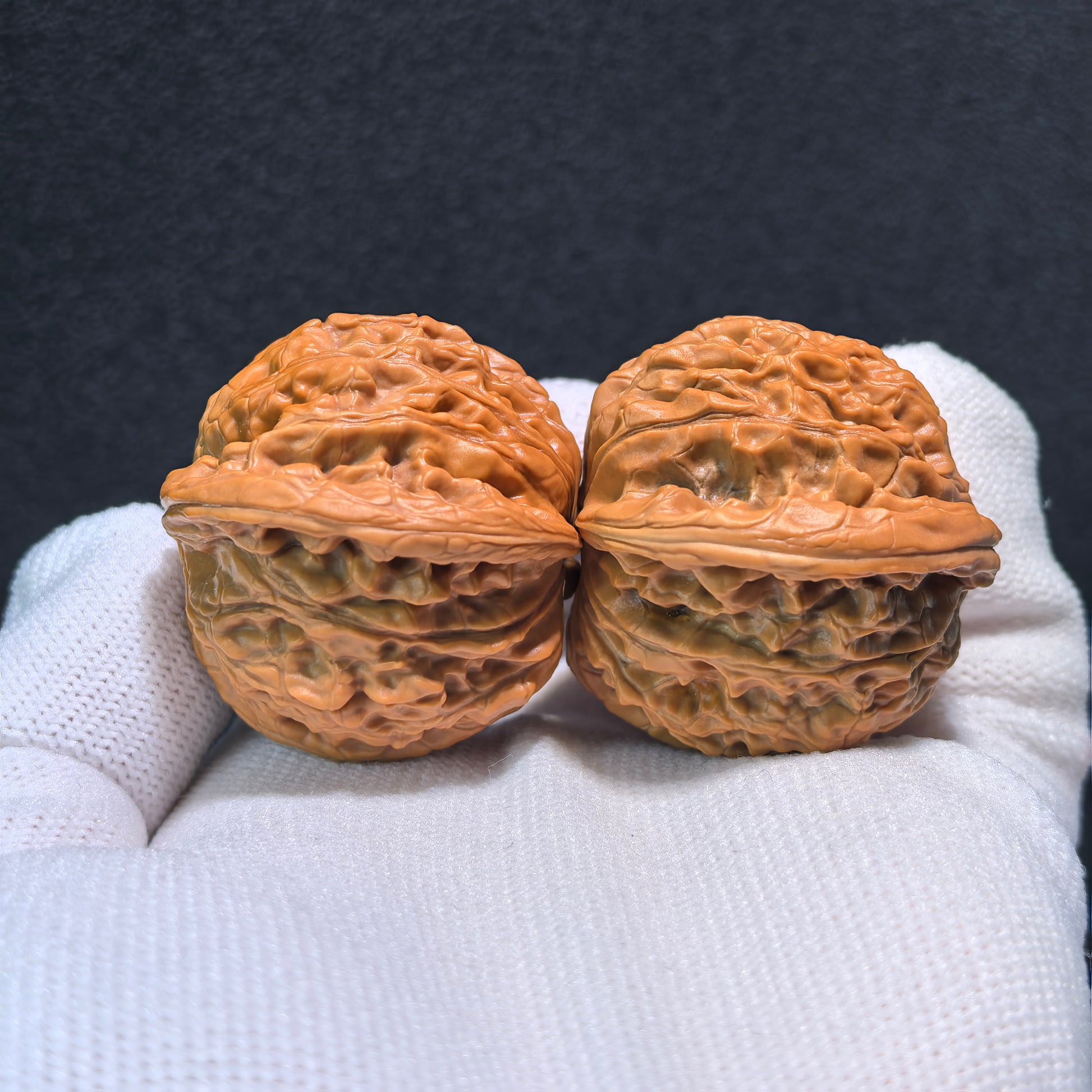 Walnut hand exercisers pair called Millstone (Mo Pan), 39mm x 36mm, from ThePatinaProject, showing smooth wooden grips for hand strength.