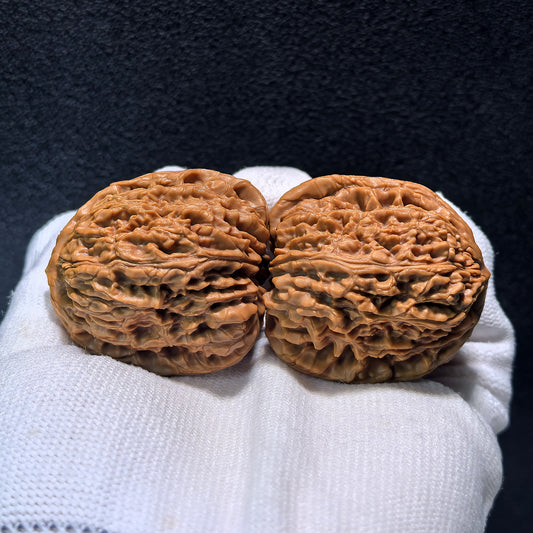 Pair of Nan Jiang Shi Walnut Hand Exercisers from ThePatinaProject, high-profile Gao Pao design, 40mm by 39mm.