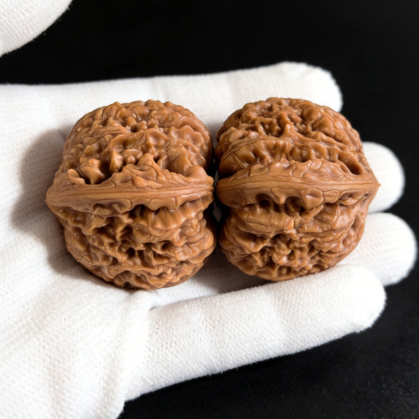Pair of Nan Jiang Shi lion head walnut hand exercisers from ThePatinaProject, measuring 41mm x 39mm, with detailed lion head design.