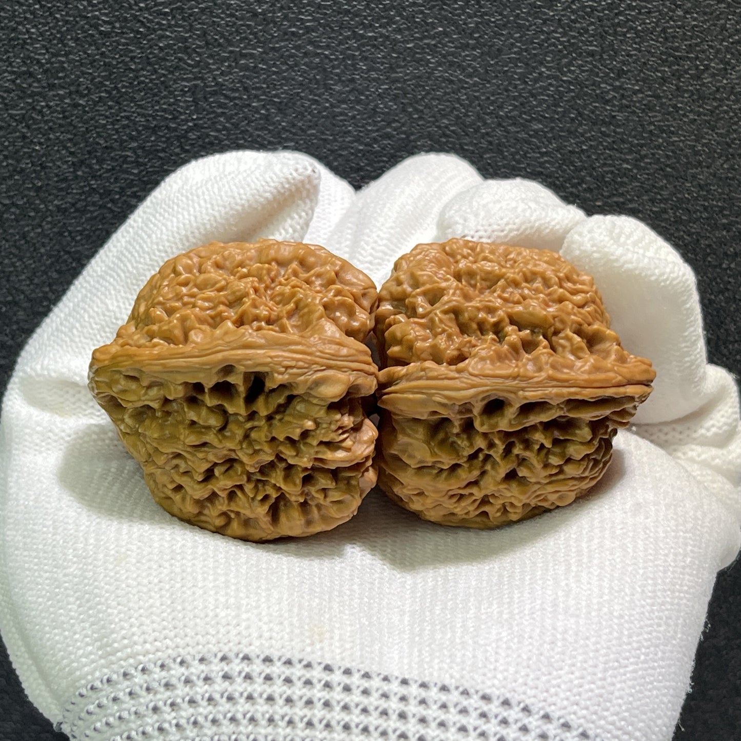 Walnut hand exercisers labeled NJS-408 from ThePatinaProject, measuring 40mm by 38mm, shown in a close-up image.