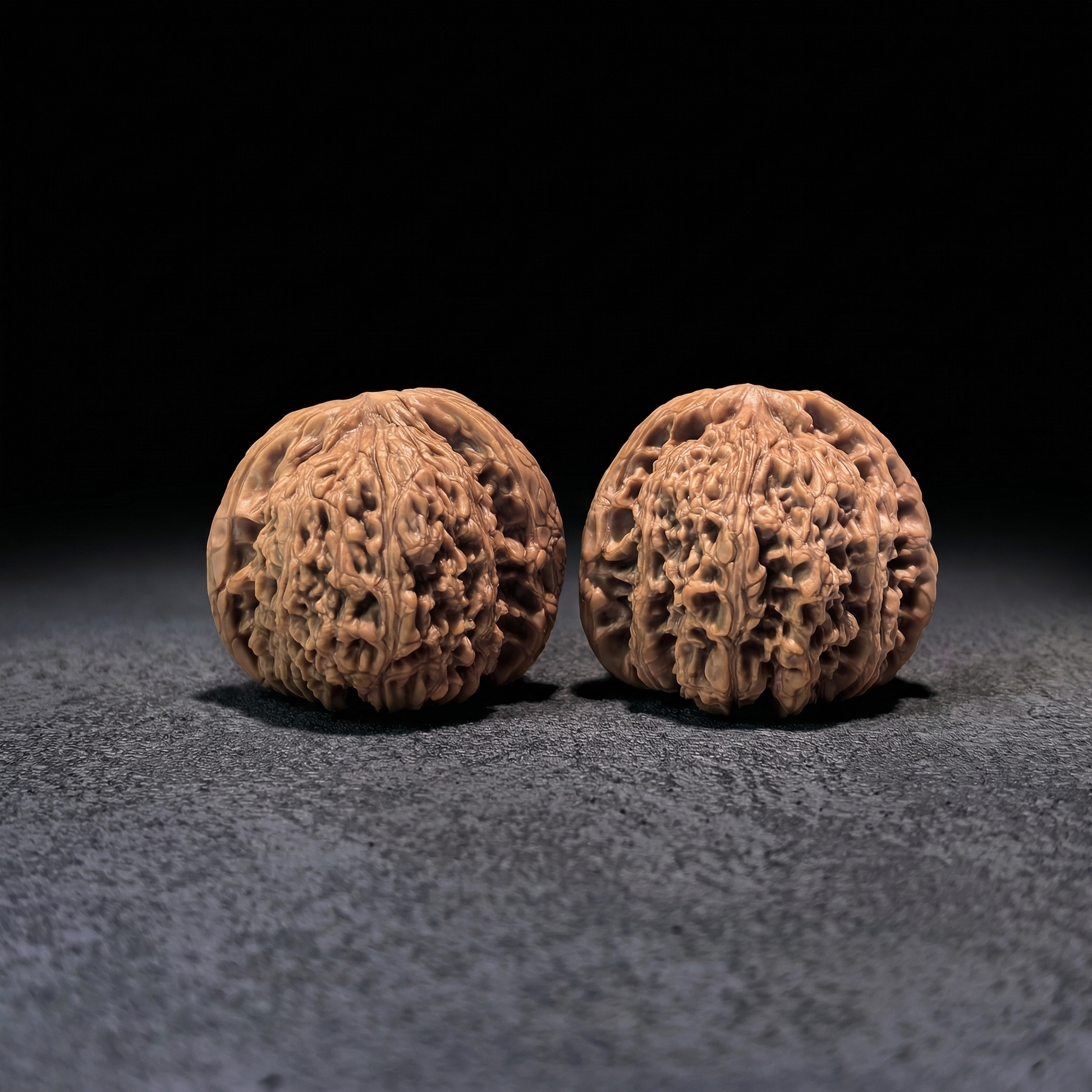 Walnut hand exerciser pair from ThePatinaProject, NJS-404 model, measuring 42mm x 39mm, designed for grip strength training.