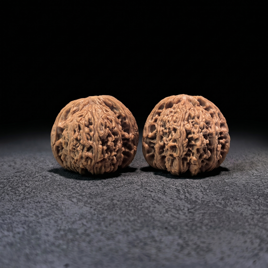 Walnut hand exerciser pair from ThePatinaProject, NJS-404 model, measuring 42mm x 39mm, designed for grip strength training.