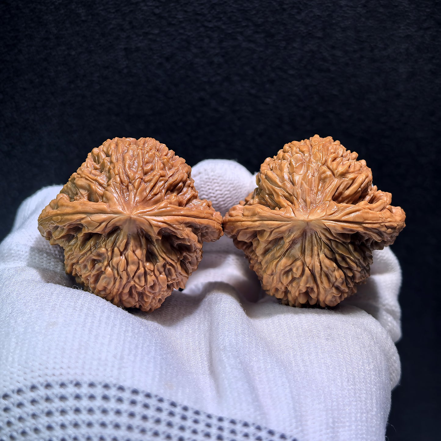 Walnut hand exercisers from ThePatinaProject, NJS-404 pair, measuring 42mm by 39mm, showing textured walnut wood grips.