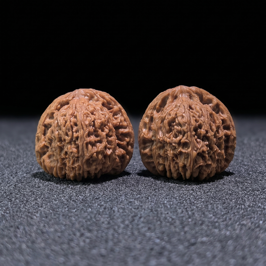 Boutique grade Nan Jiang Shi walnut hand exerciser, 42mm x 37mm, from ThePatinaProject, showcasing smooth, polished wood surface.