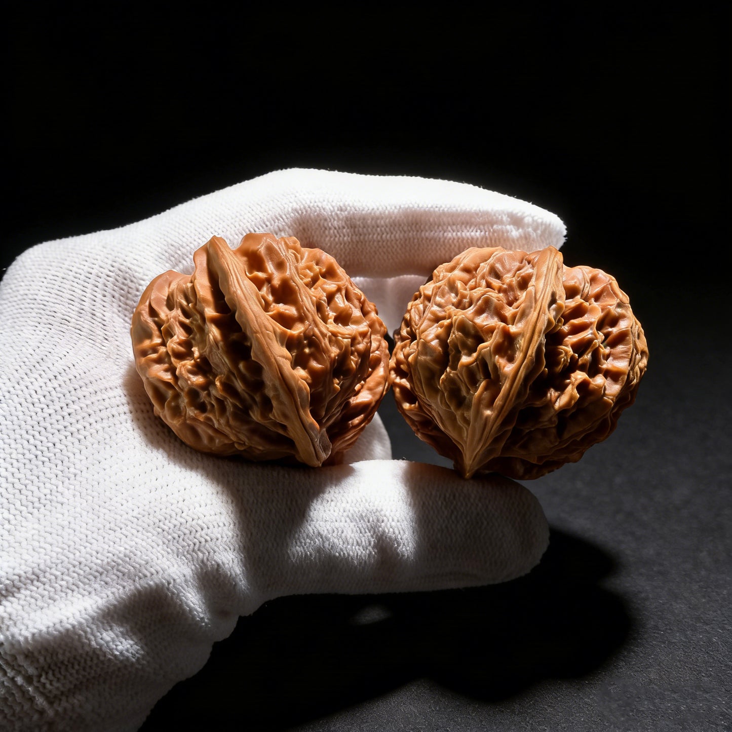 Walnut hand exercisers featuring conjoined twin design from ThePatinaProject, premium collection grade, measuring 54mm by 38.3mm.