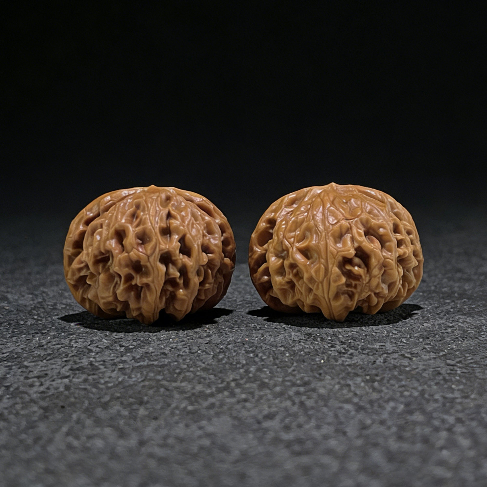 Pair of Walnut Hand Exercisers called Palace Lantern, 44mm x 42mm, from ThePatinaProject, featuring smooth wood finish and ergonomic design.